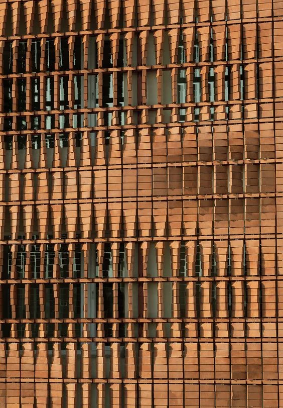 Close up of the façade of the Cloaked in Bricks by Admun Design & Construction Studio as seen on www.archdaily.com