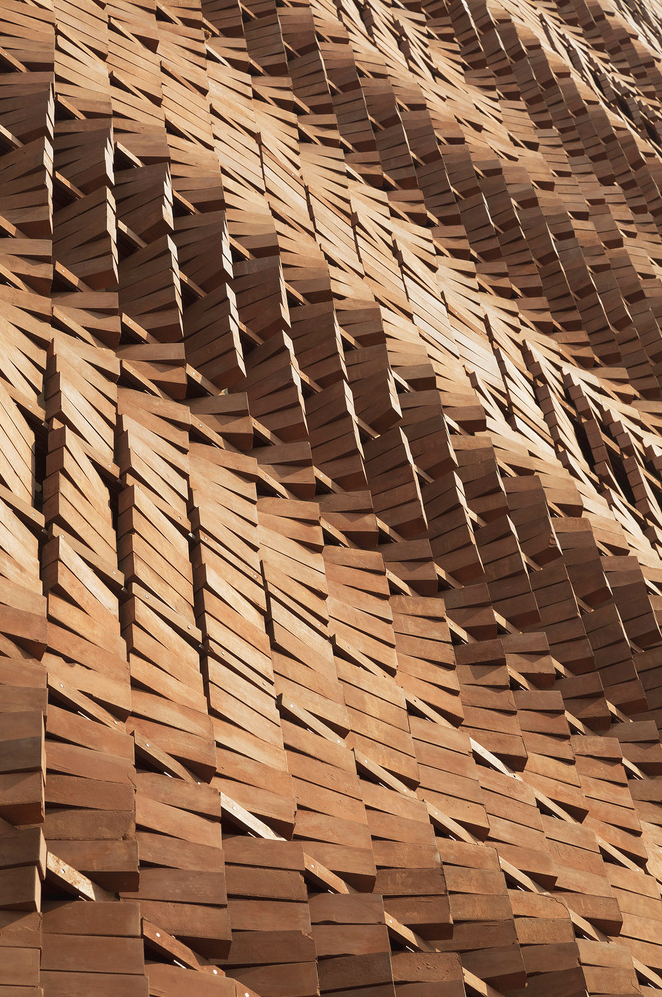 Dynamic detail of the façade of the Cloaked in Bricks by Admun Design & Construction Studio as seen on www.archdaily.com
