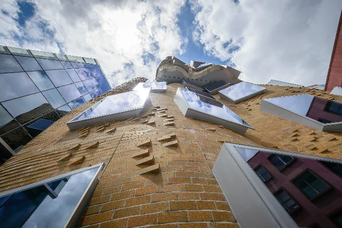 Looking up view Dr Chau Chak Wing Building in the campus of the University of Technology in Sydney by Frank Gehry in Australia as seen on www.sourceable.net