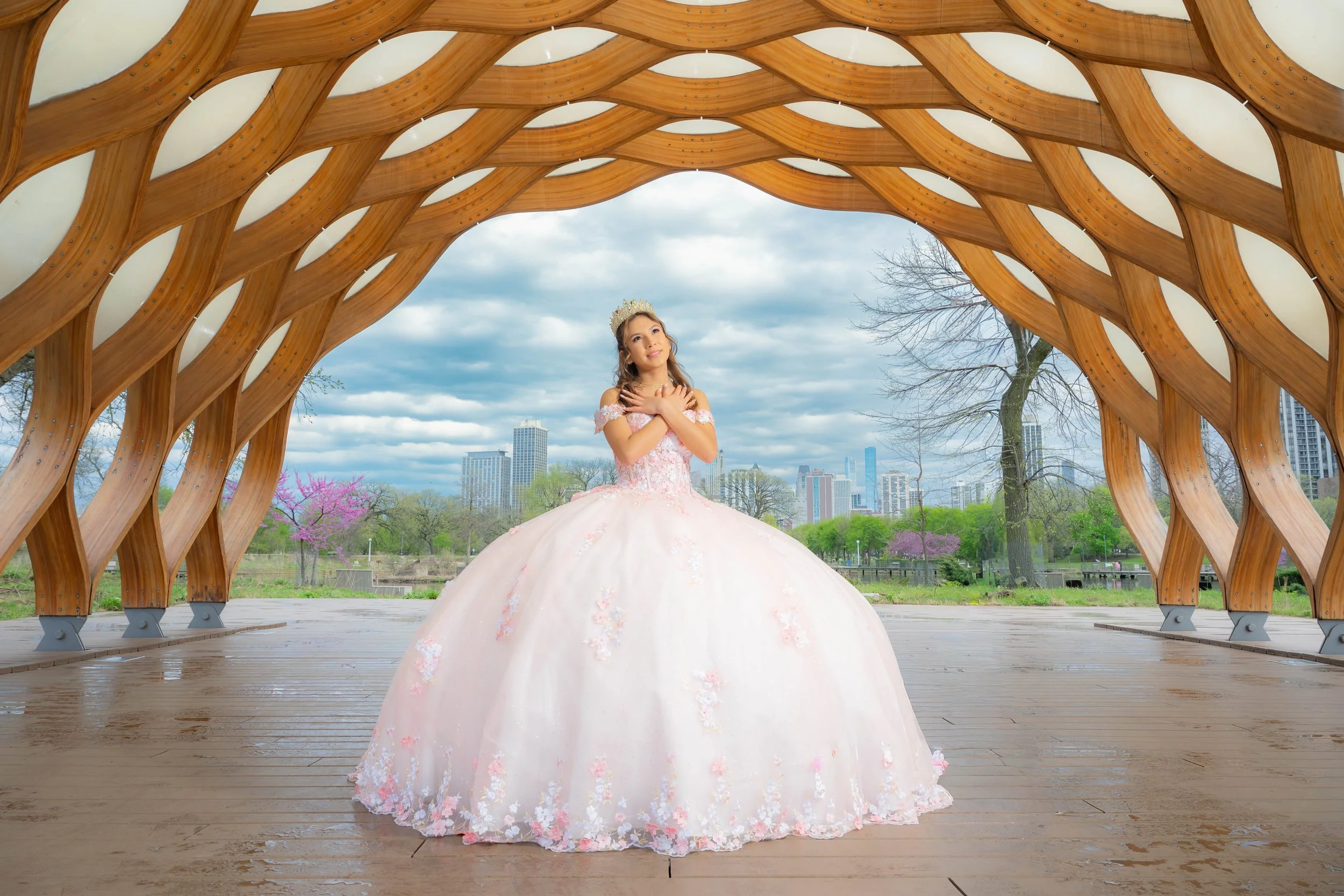 Quinceañera session at Lincoln Park South Pond Pavilion with city skyline backdrop