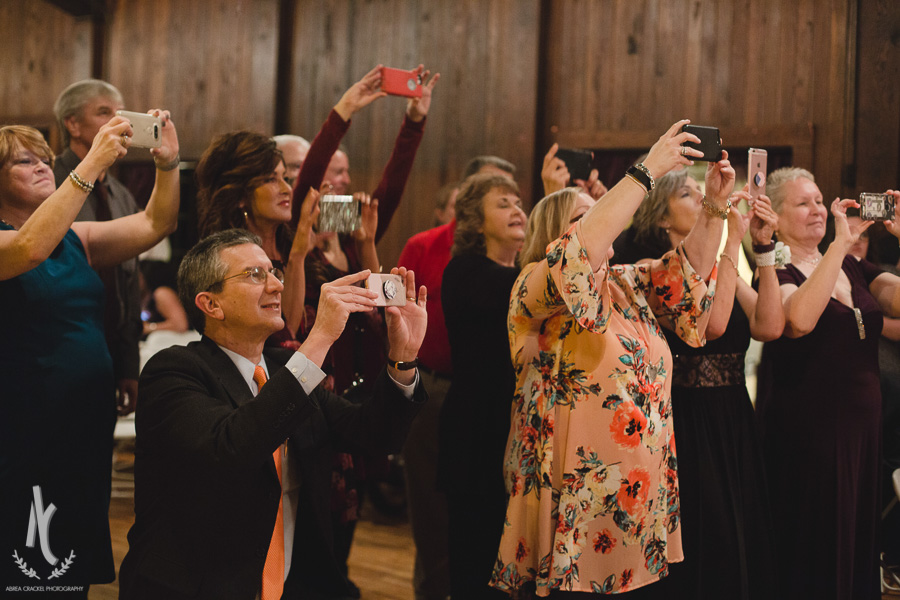  You can tell how much this couple is loved by the amount of pictures everyone wanted to take of them and with them during the reception! (I do want to say thank you to the guests for being respectful for us, this picture could make it seem like this