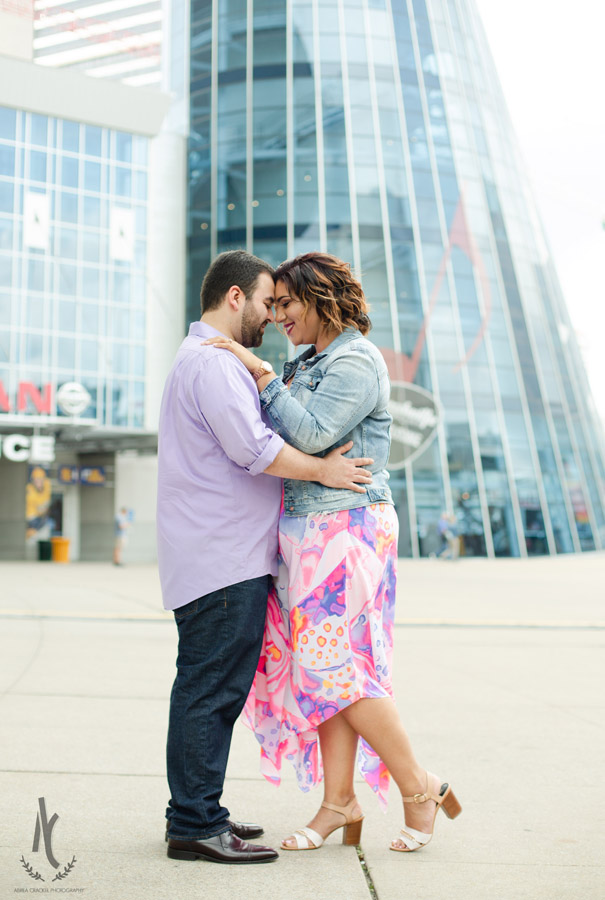 Engaged couple in front of Bridgestone Arena in Nashville, TN