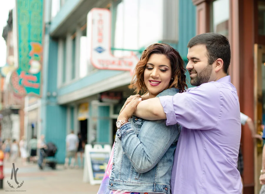 Engaged couple on Broadway Street in Nashville, TN