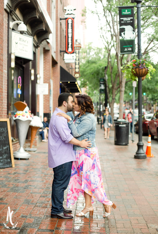 An engaged couple kissing on the street of Downtown Nashville Tennessee