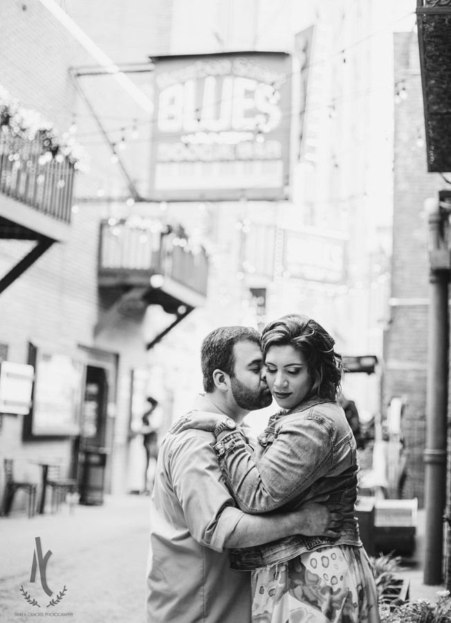 Engagement picture of a couple in Printer's Alley in Downtown Nashville, Tennessee