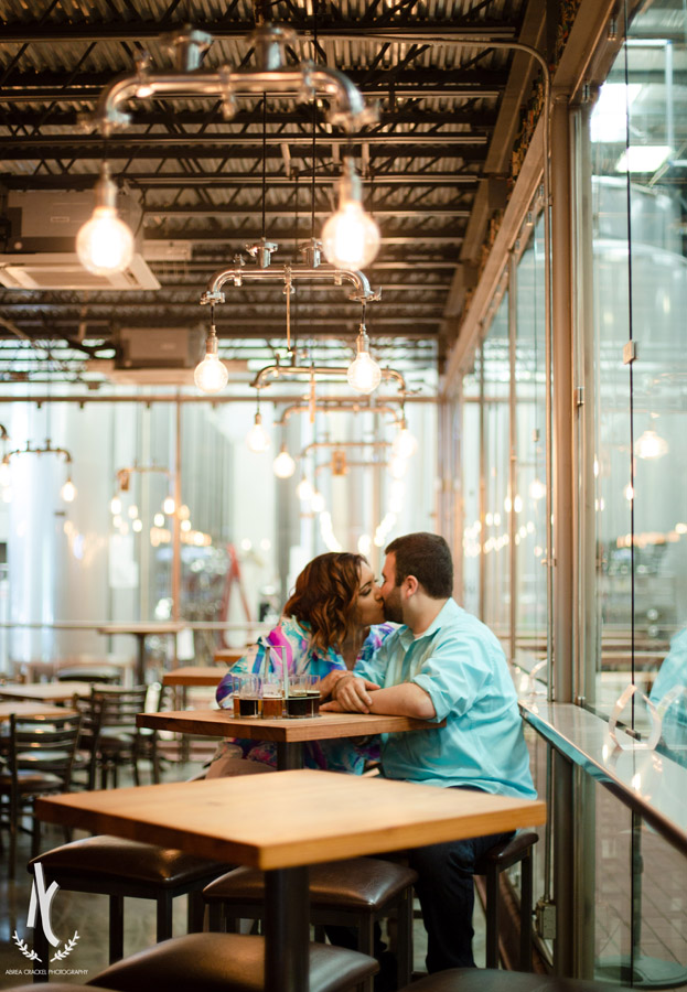 A couple kissing in Blackstone Brewery in Nashville, Tennessee