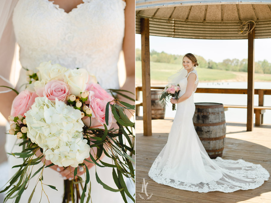 Bridal bouquet with pale pink roses and greenery in a rustic barn setting. 