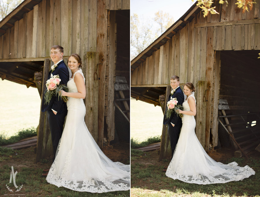 Bride and groom in front of rustic barn in McKenzie, Tennessee