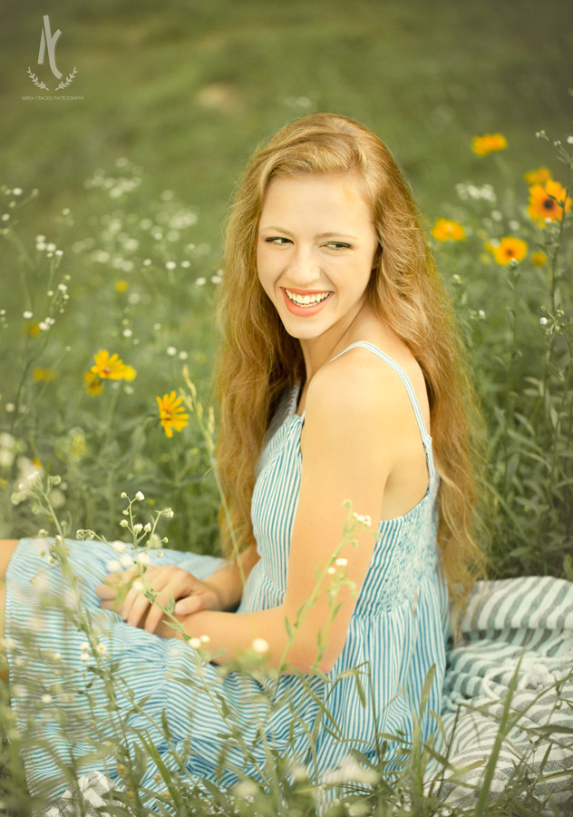 High School senior girl sitting in patch of wildflowers in Martin, Tennessee 