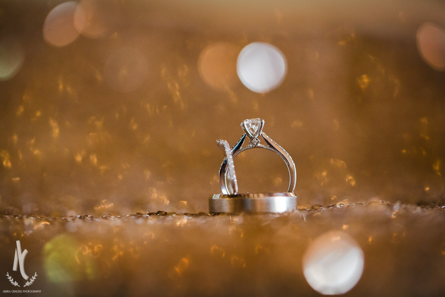 Wedding rings on a sparkling bed of sequins 