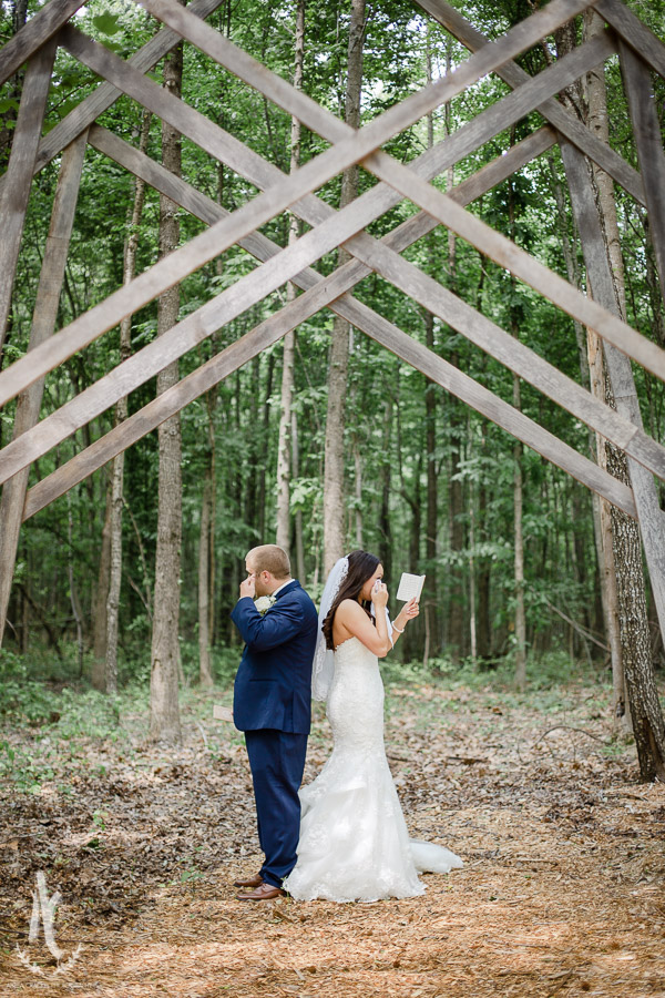 Bride and groom wipe away tears before their first look 