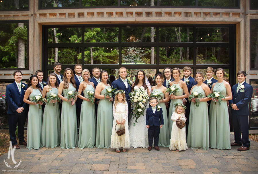 Wedding party in front of industrial doors