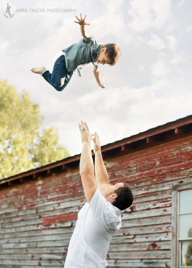 Dad throws toddler in the air to catch him
