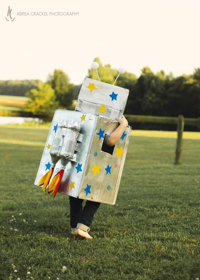 Four year old boy in robot birthday costume