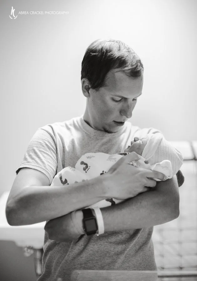 First time holding his second baby girl. :) 