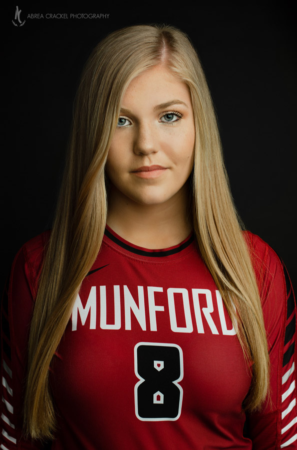 I don't do this kind of picture often since I don't have a studio, but being family has its perks. :) We had to get a few pictures with her volleyball gear! 