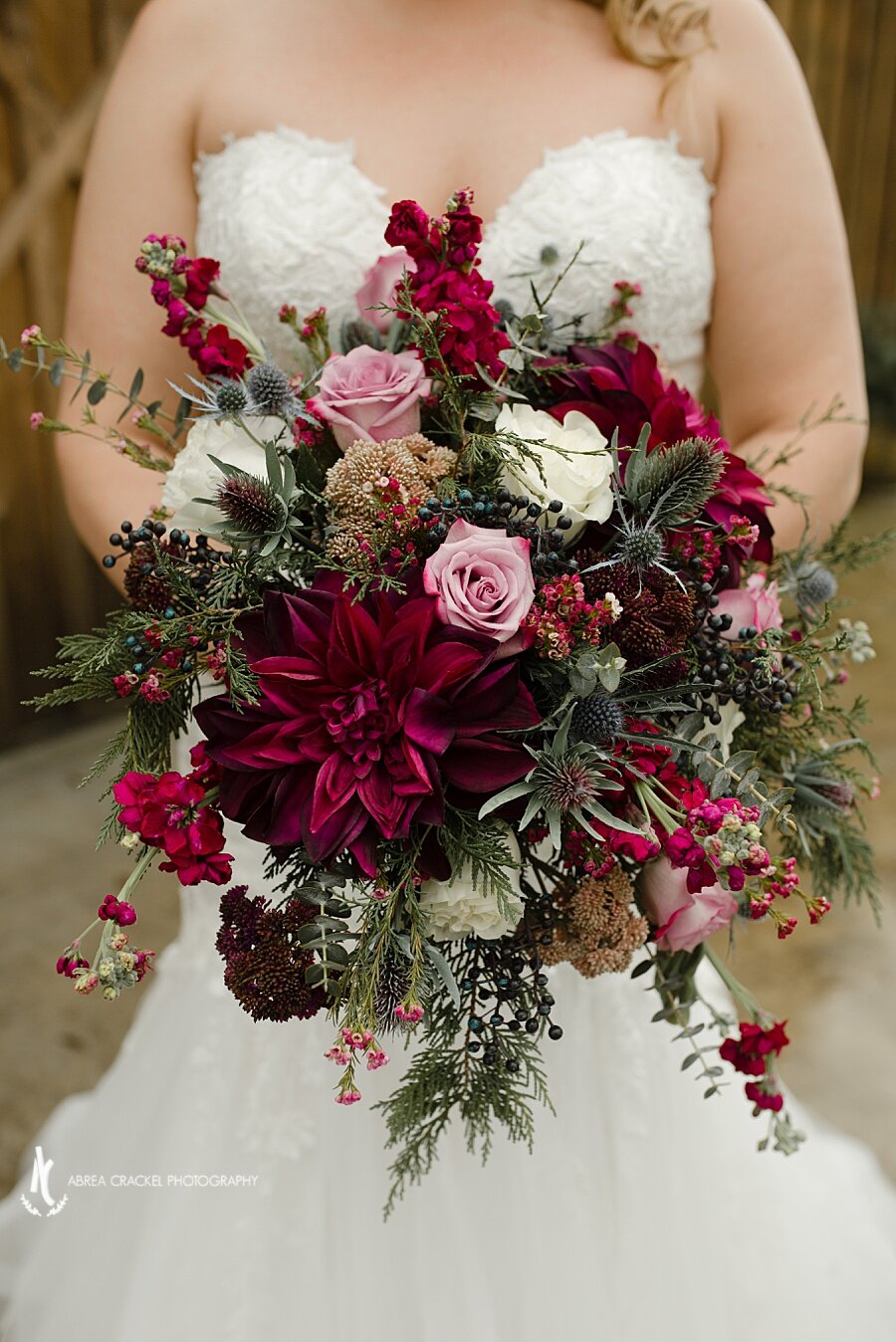  Though I love a good blush-toned bouquet, these jewel tones  just speak to my heart! Perfect for their winter wedding! 