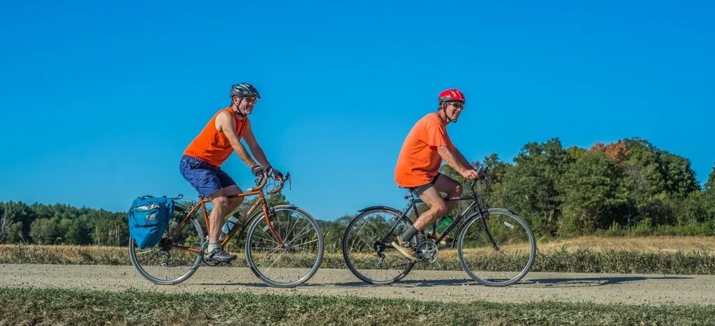 these guys are the epitome of good safety! bright clothing, helmets, single file riding... two thumbs up, orange team!