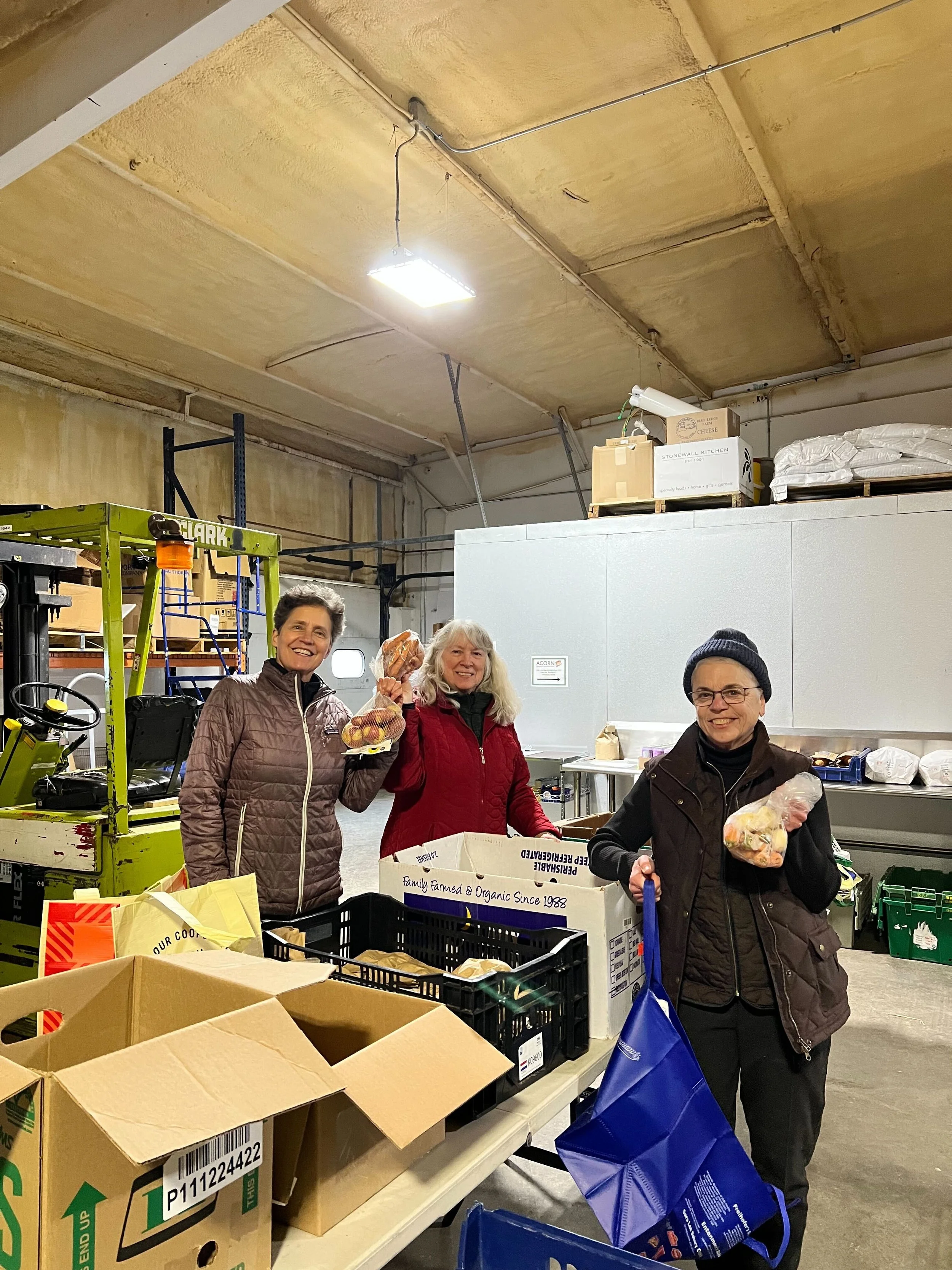 25-26 Winter Farmacy volunteers packing bags.jpg