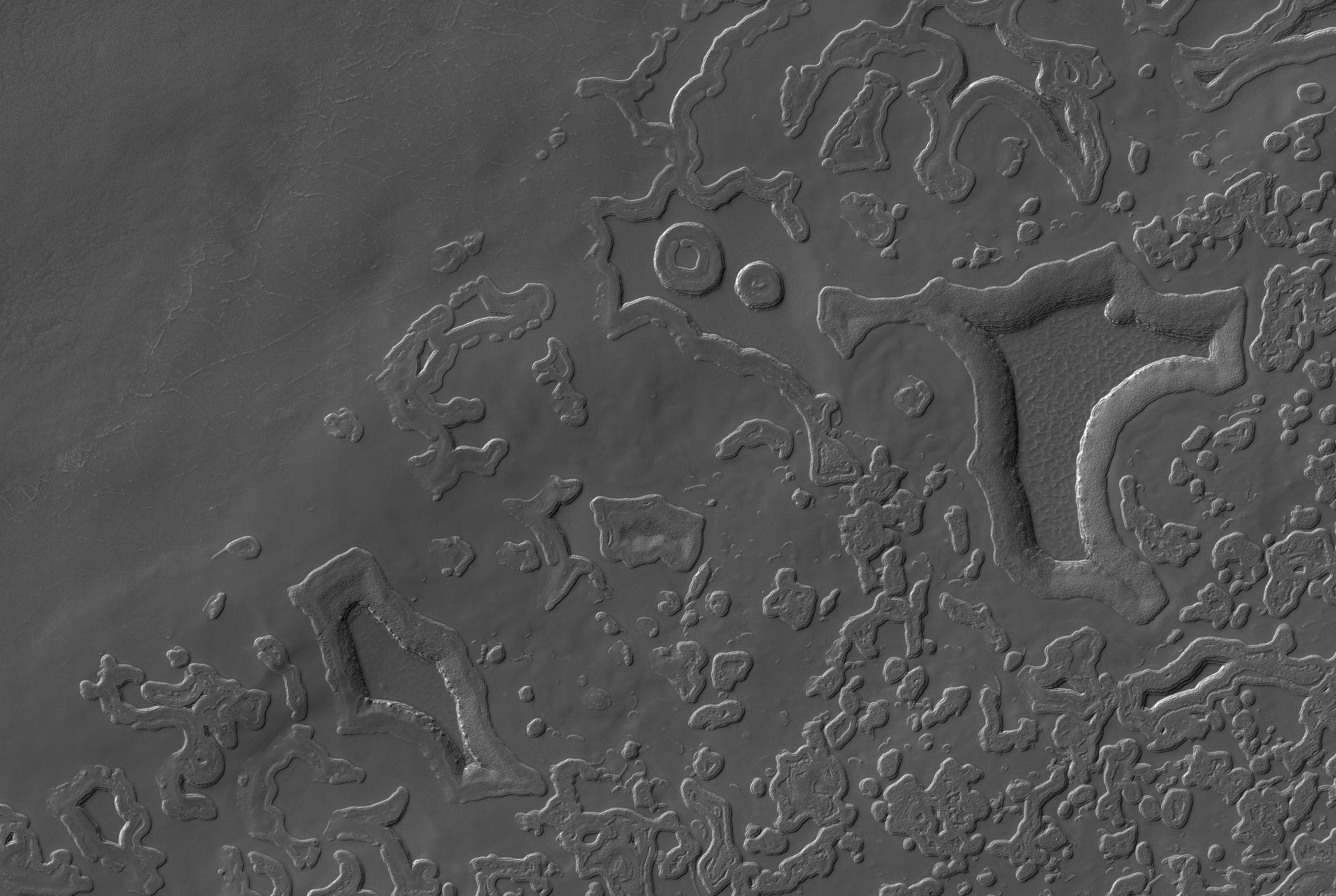 Beautiful water ice cracked floors of the pits and some double-ring features near the top-center of this image. Credit: HiRISE.