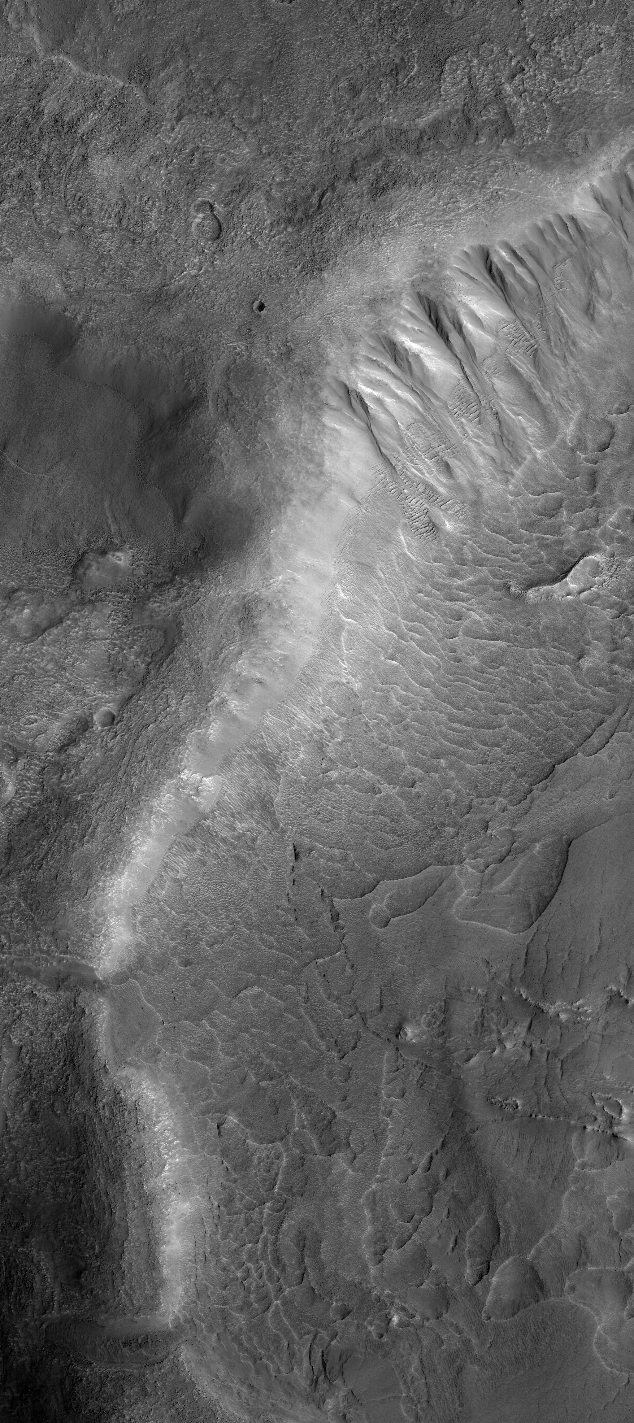 Gully and bedrock structures within Hellas Basin. Image credit: HiRISE-ASU.