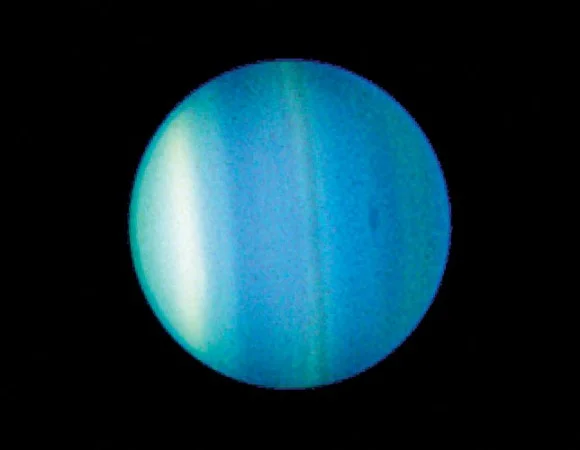 Uranus as seen by the Hubble Space Telescope. Note the cloud bands of different ices! Image credit: NASA/ Hubble.