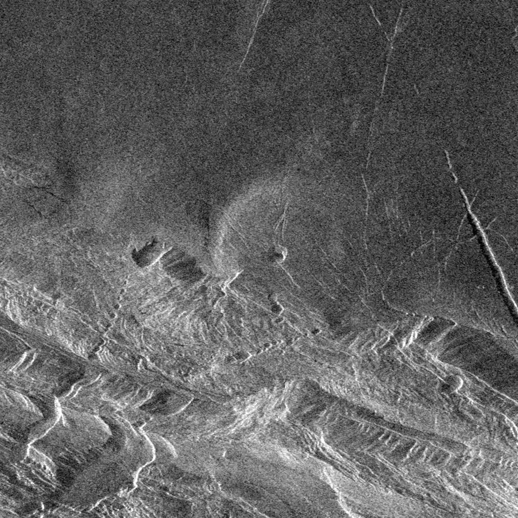 Magellan image of Lakshmi Planitia (north of image) bounded by Danu Montes mountain range (south). Image credit: NASA/JPL