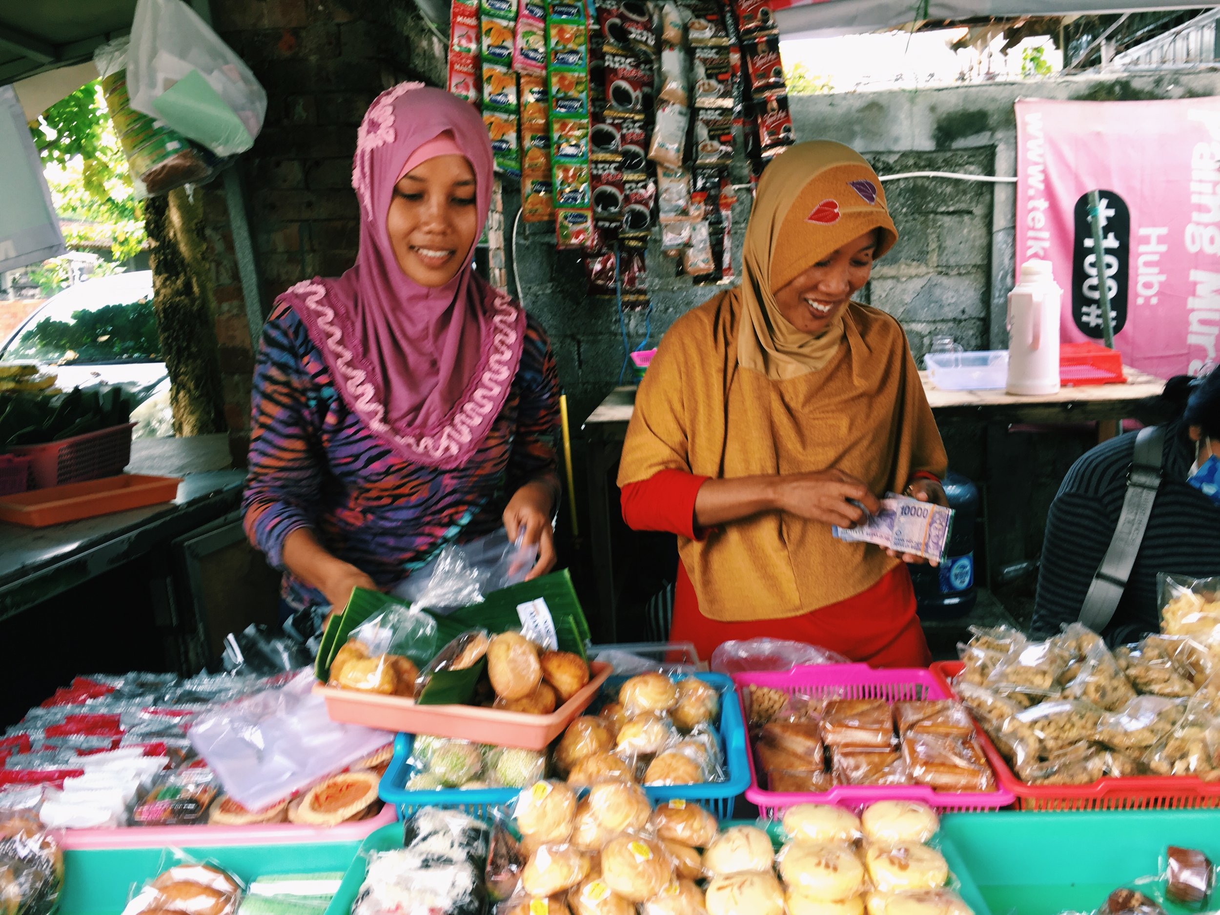 Beautiful Indonesian women selling what we call, "street food."