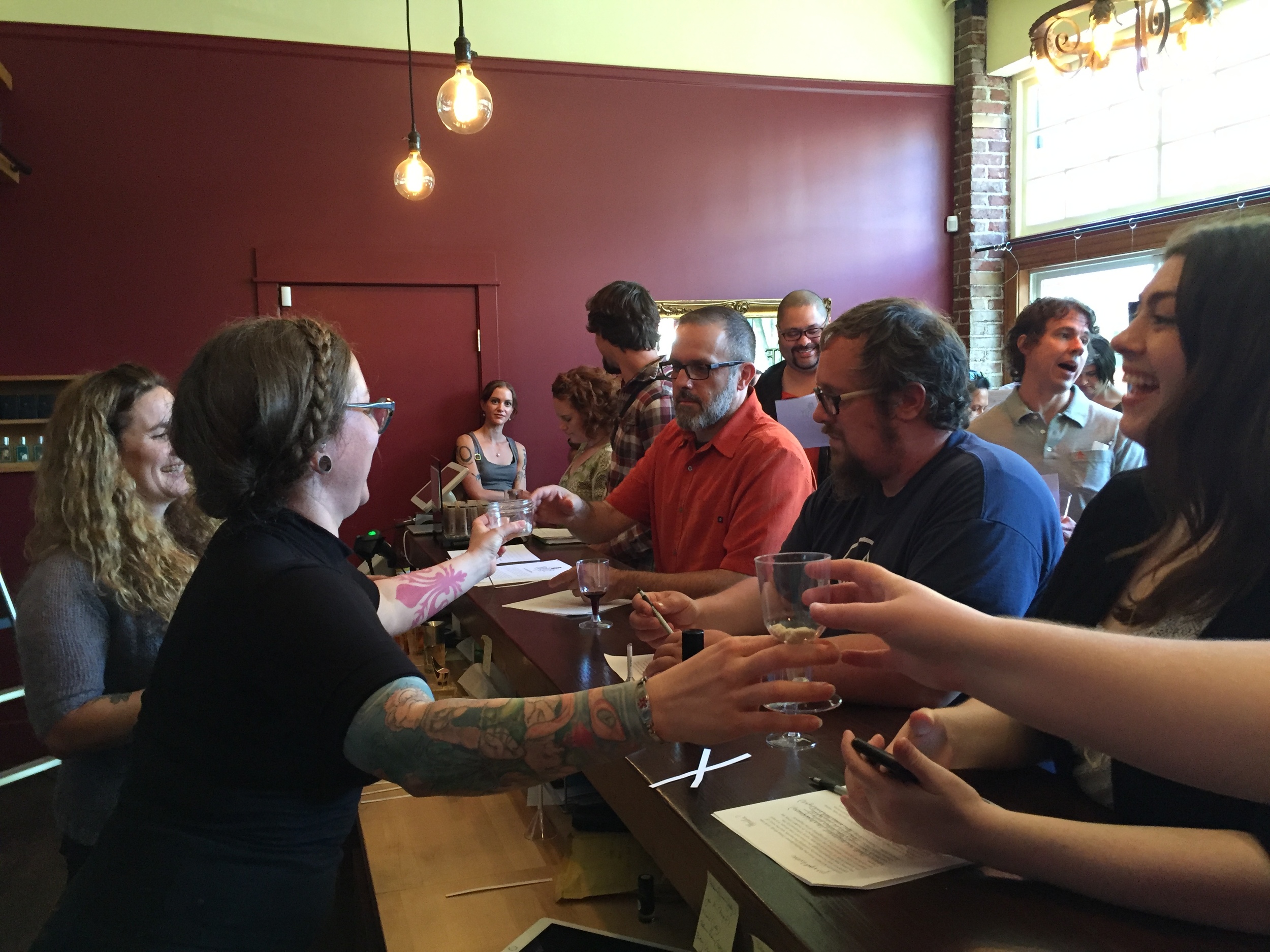 Attendees engage with Nicole and Fumerie owner Tracy Tsefalas.