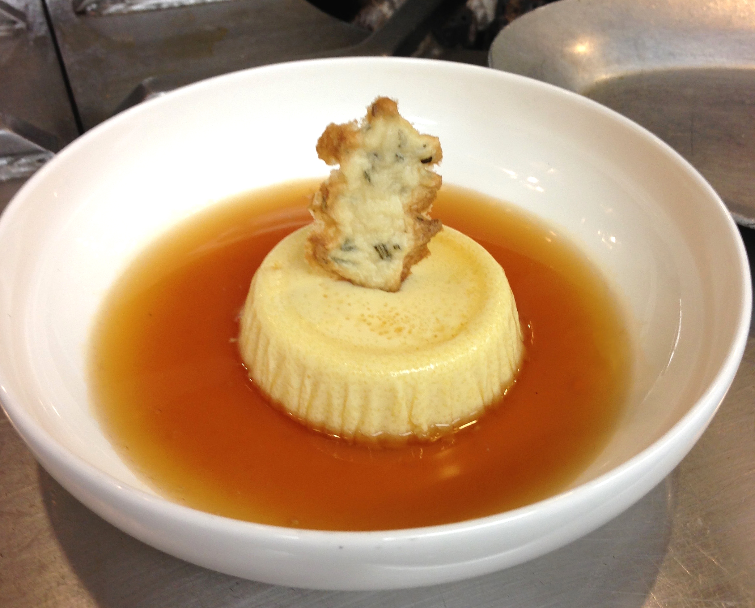 Parmesan and Roasted Garlic Flan in Tomato Consomme