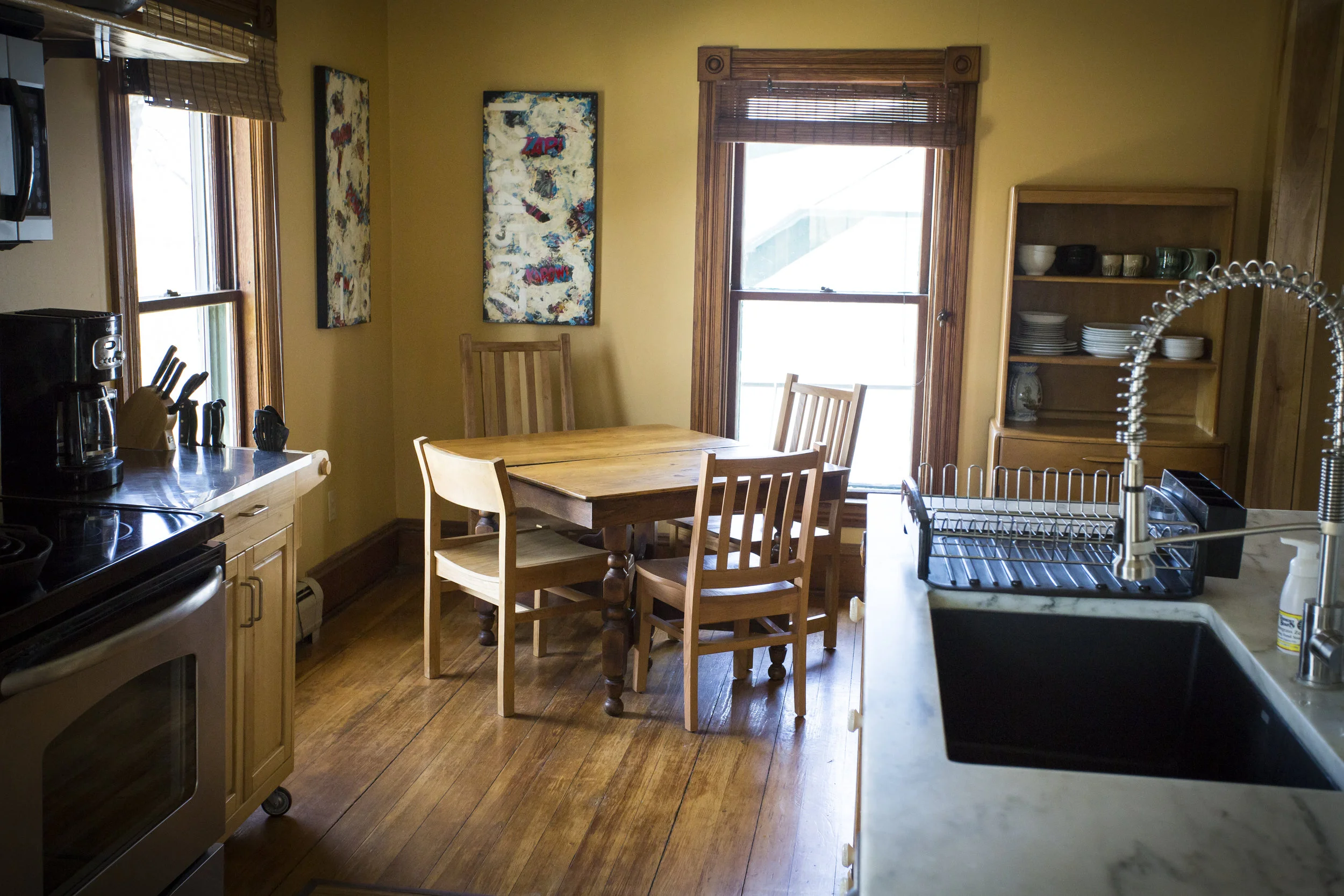 Left Wing kitchen - Spacious and bright dining area, with locally sourced art, solid furniture