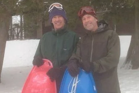 The "torpedo" brothers. The least expensive and all-around most adaptable sled. Right: Izze welcomes winter guests