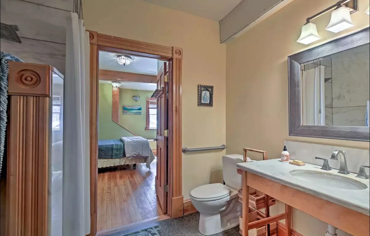 West Wing bathroom - ADA accessible, marble sink counter, granite heated floor