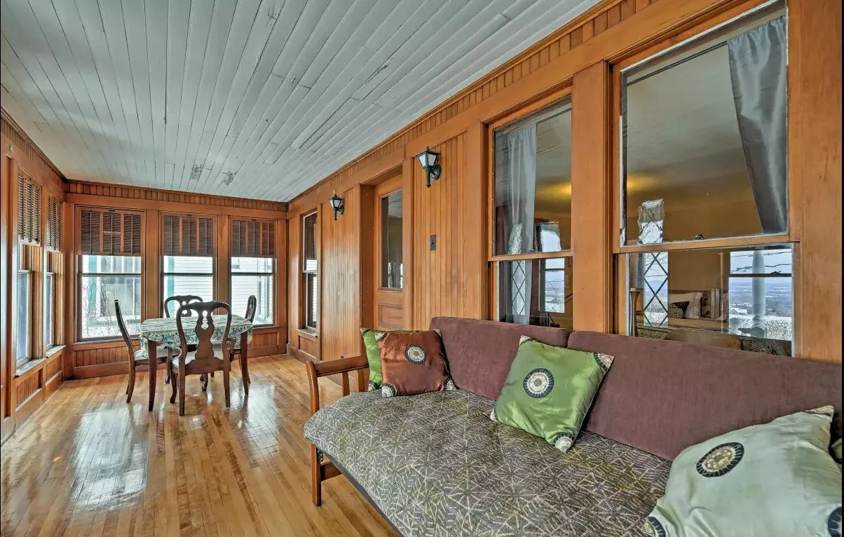 West Wing porch - Paneled interior porch with fantastic sunset views of the lake