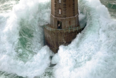 My master coach has this image hanging in her seminar room. Life feels a little like this today, no? The photograph was taken by French photographer Jean Guichard . The man survived the storm. 