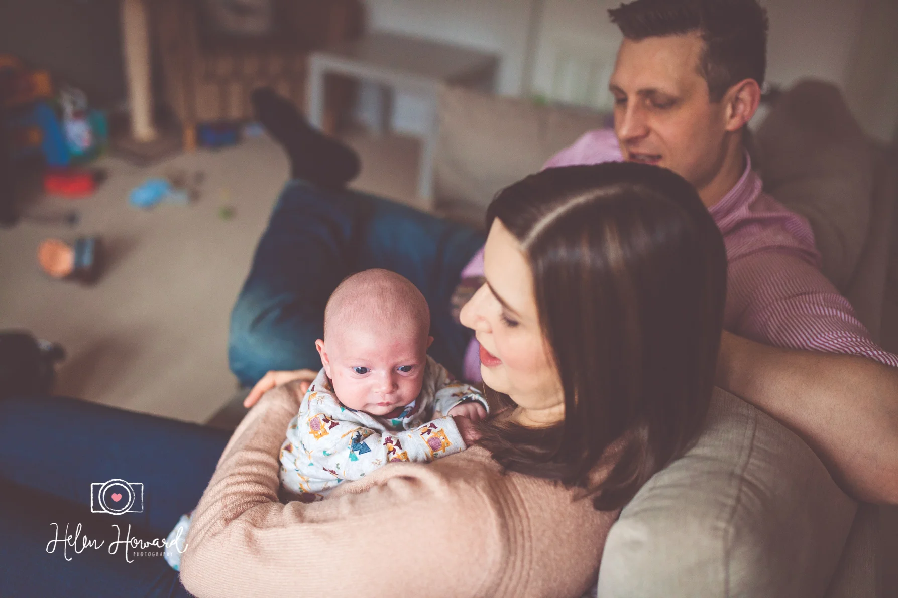 A mother and father with their newborn baby boy portrait photography by Helen Howard