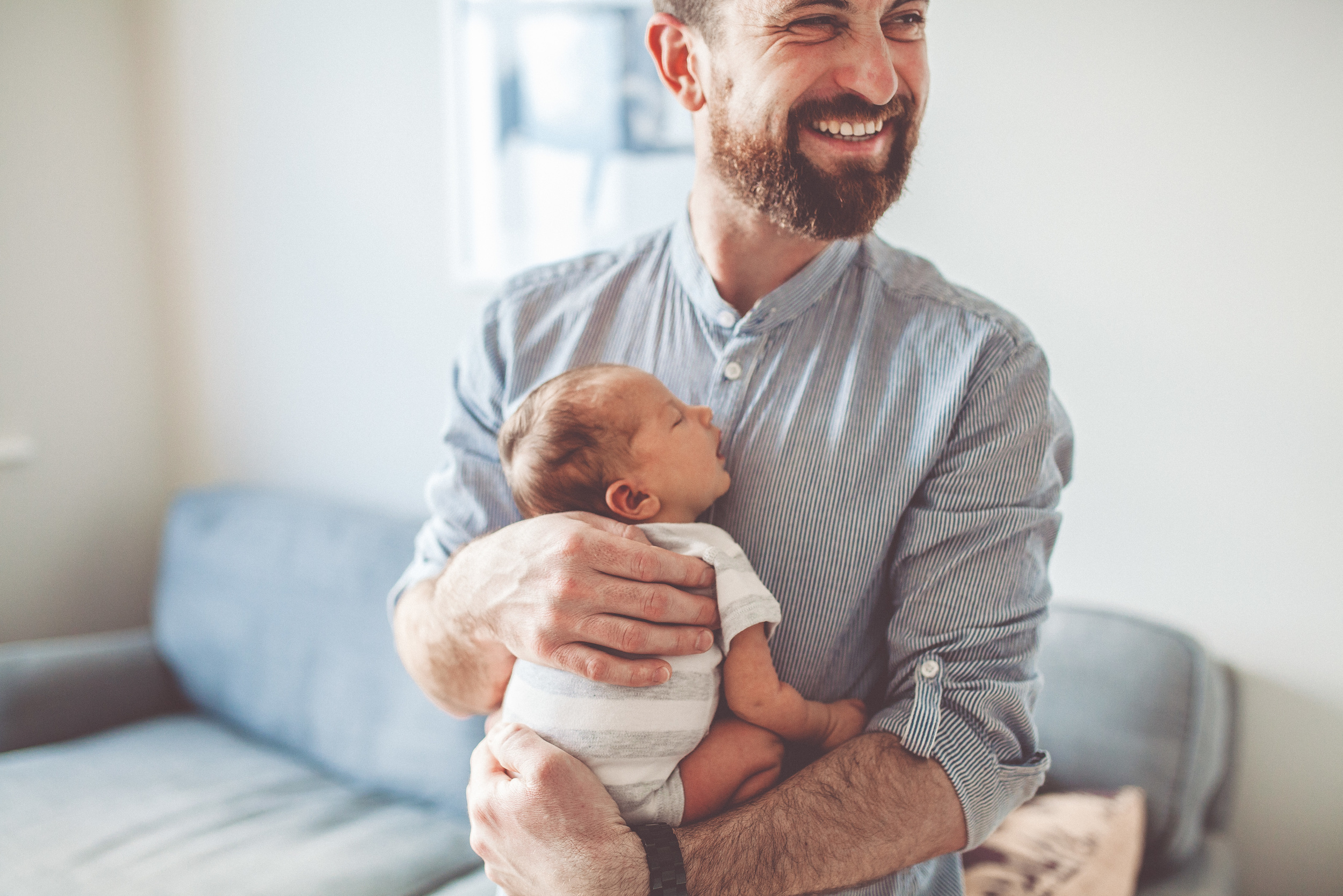 A father holding his baby son