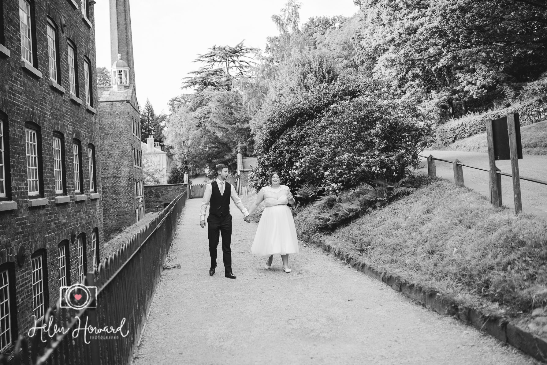 Bride and Groom walking at Quarry Bank Mill Weddings Styal-1.jpg