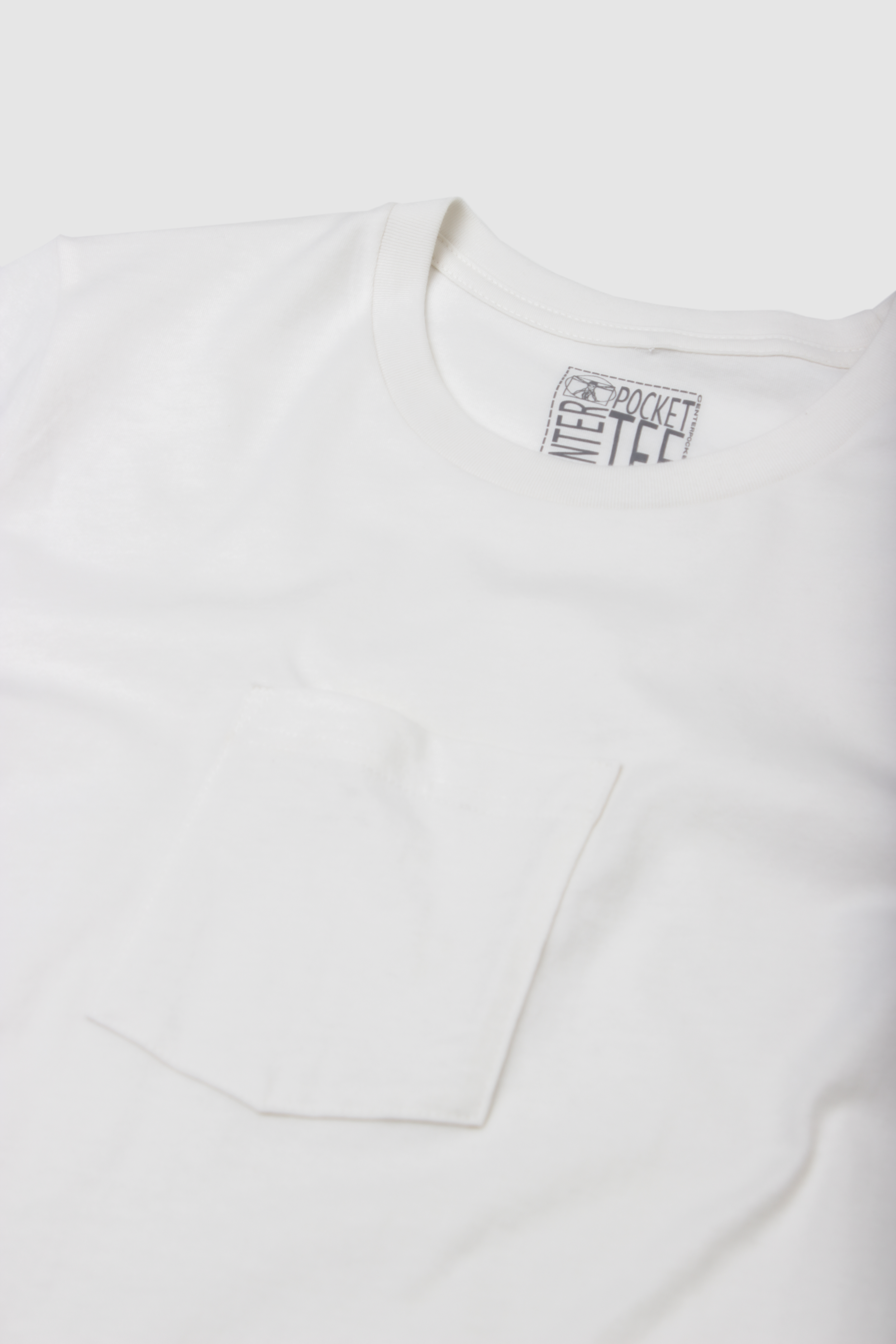 A t-shirt with a pocket in the center of the shirt. A center pocket tee..