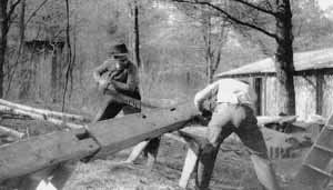 Lincoln County Rifle Club members saw lumber for their clubhouse circa 1935.