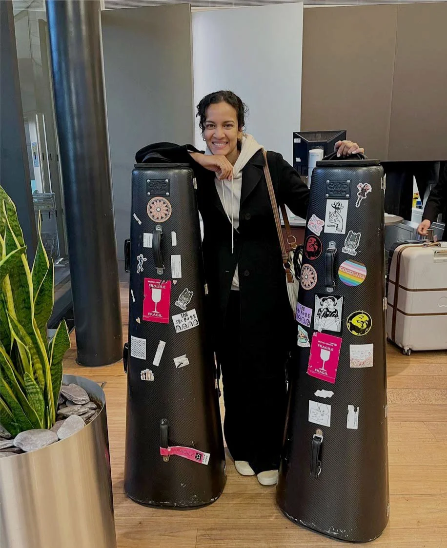  Anoushka Shankar    and her sitar cases with some *PMH and ThisOnly stickers.
 Slide ←  01  of  09  →