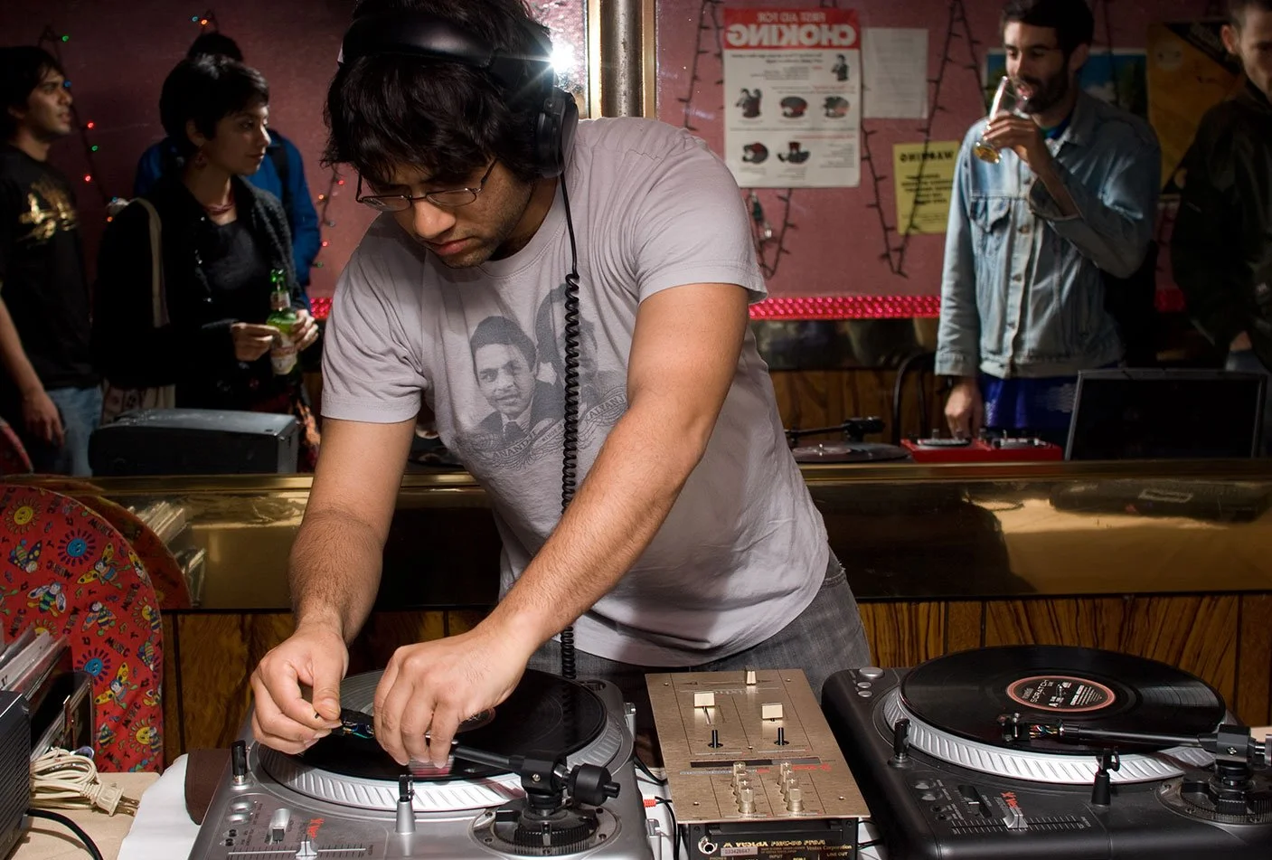 (2006) Function at the Royal Bangladesh (1st Ave, NYC) sharing some of my new work. Koushik (Stones Throw) spins some vinyl for the evening. I only made a handful of the Kalyanji–Anandji shirts he's wearing. Photo by Aizaz