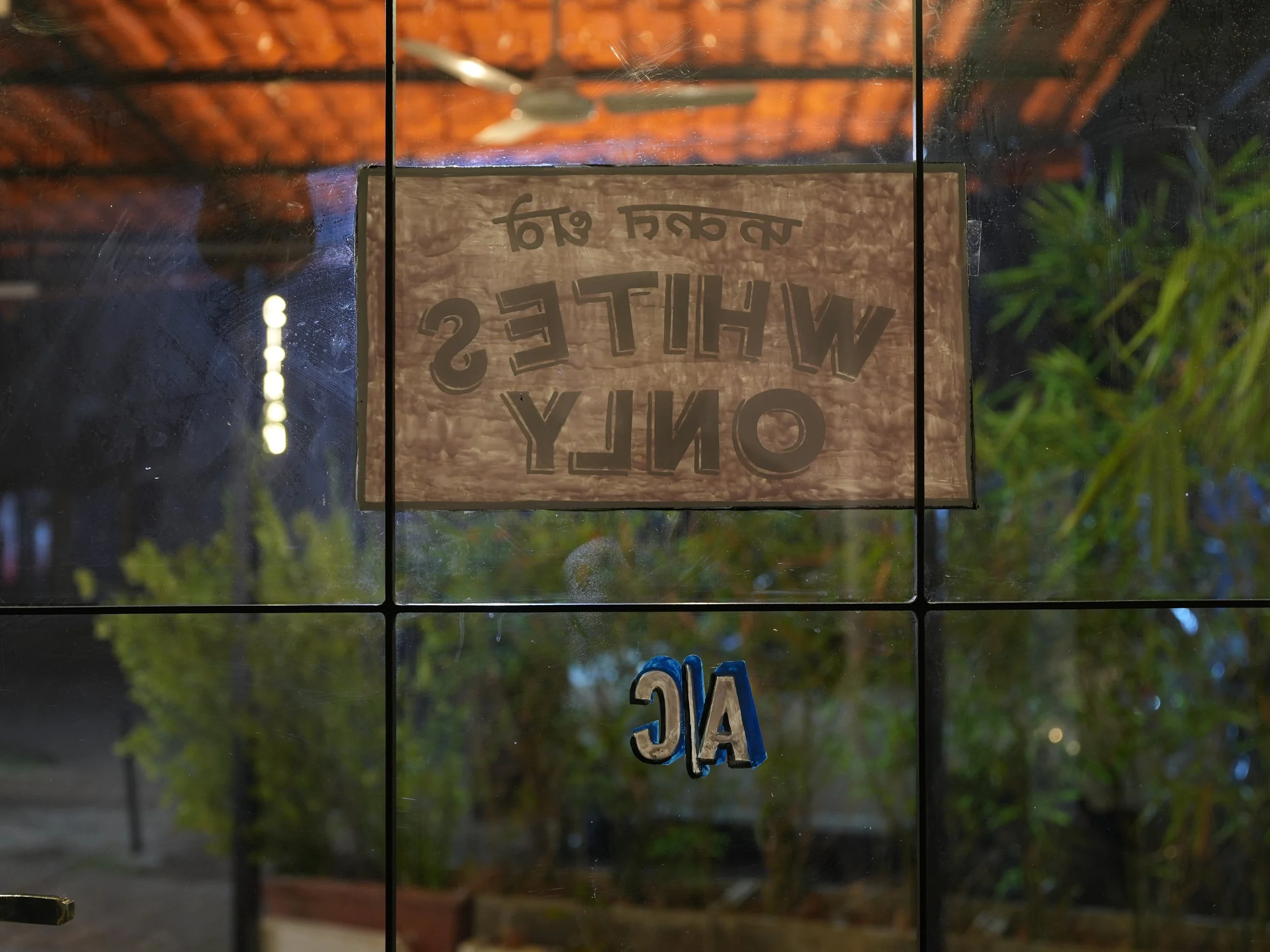  Trojan Horse (Whites Only, A/C),  2025, Oil based paint on glass door; Goa, India, 16" x16"