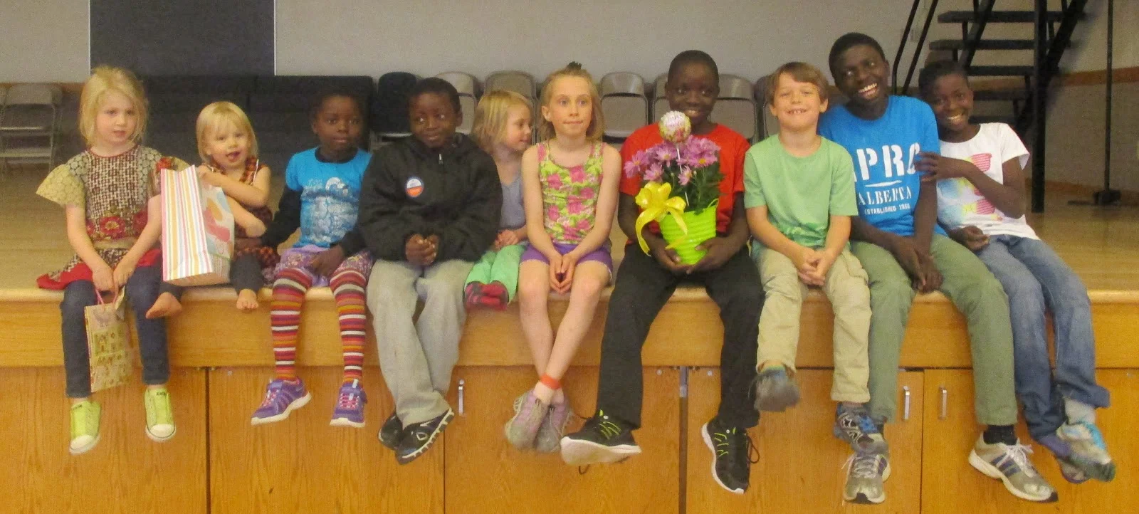 The kids getting ready for their first Easter Egg Hunt and Easter Feast!