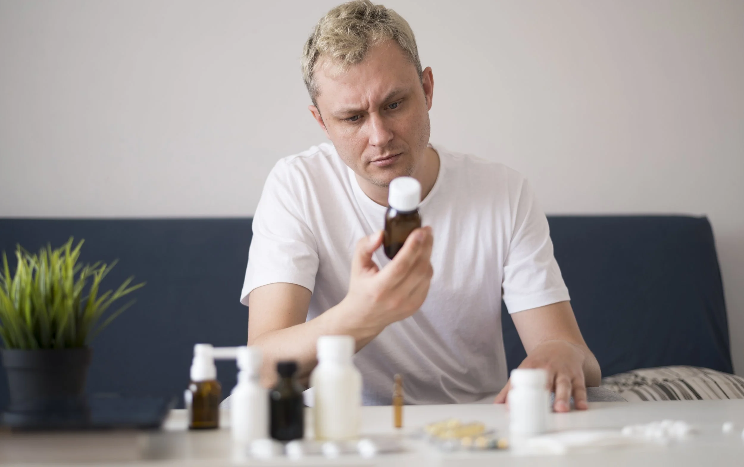 Man reading supplement label