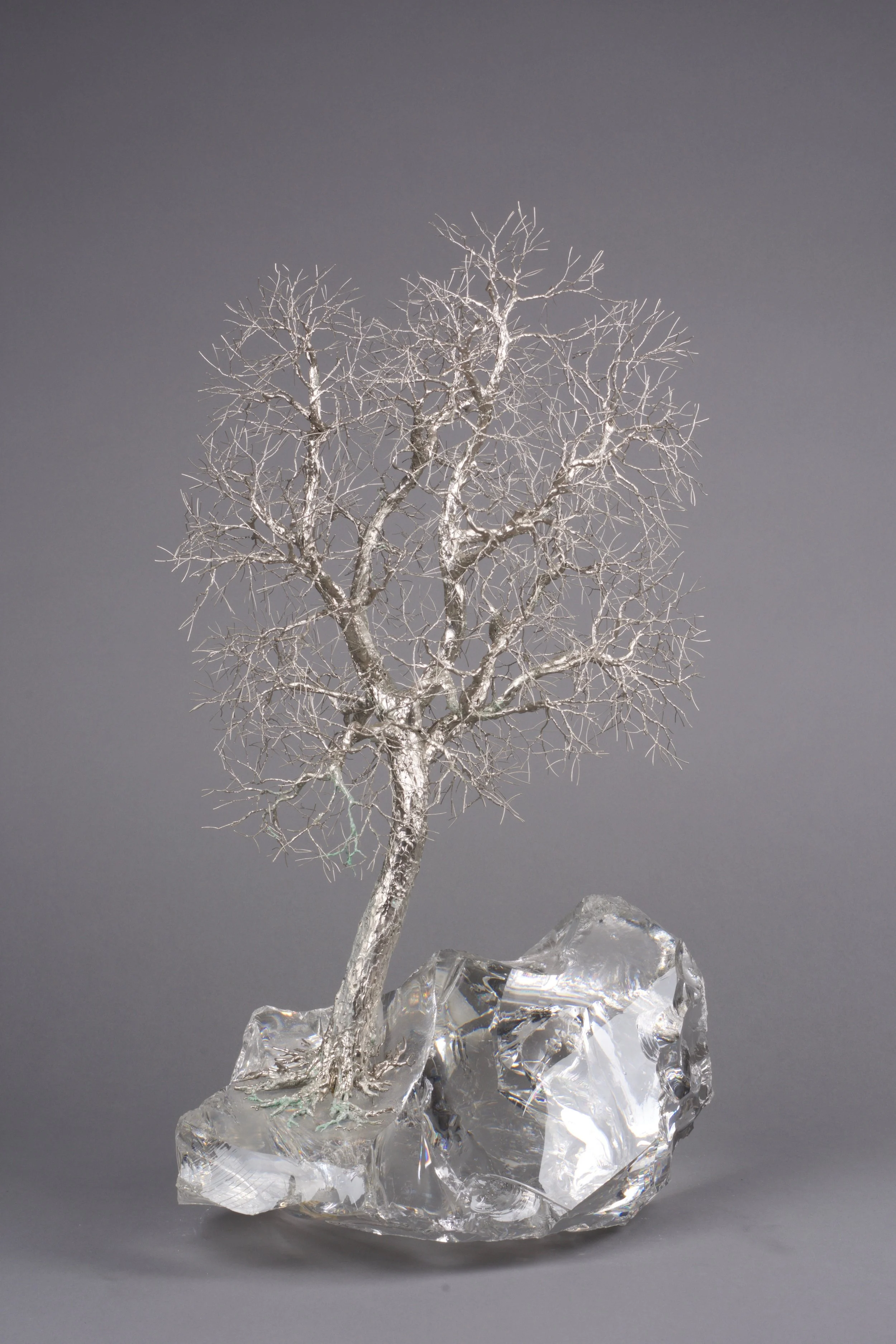 Patrick Drinkwater Iceberg Ash , 1985 bright nickel on copper, Dartington lead crystal base 50x33cm
