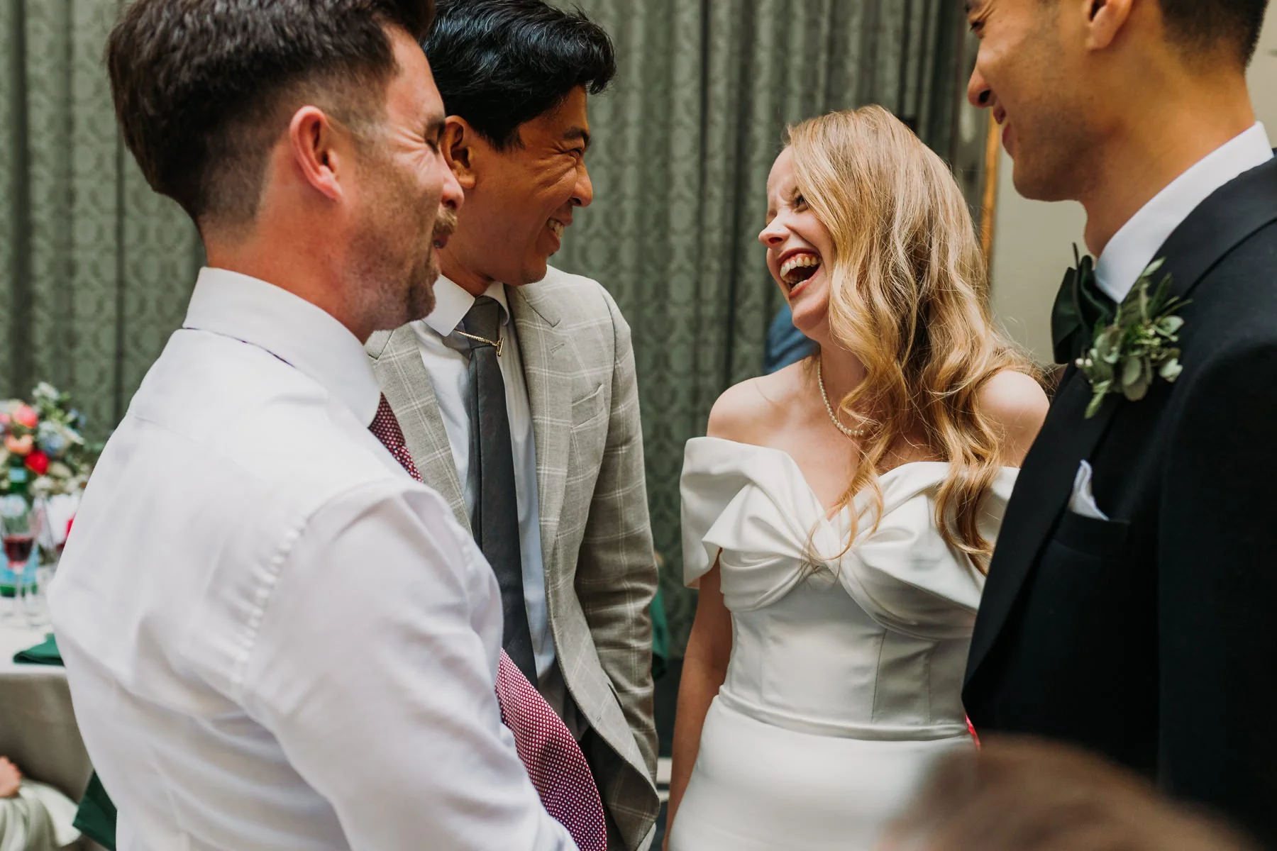 Richmond Bride Laughing while chatting with her groom and guests