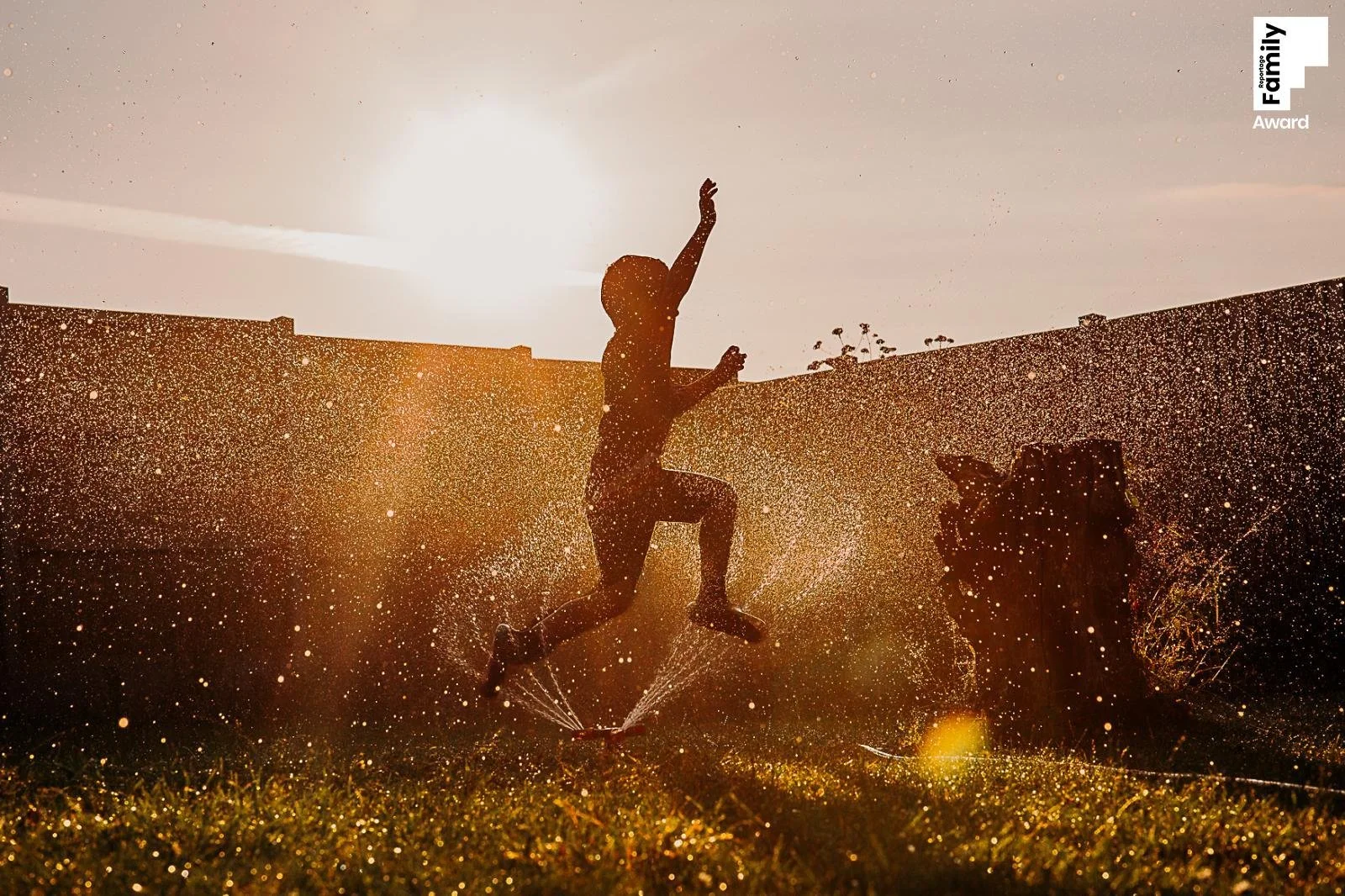 child-jumping-sprinker-sunshine.jpg