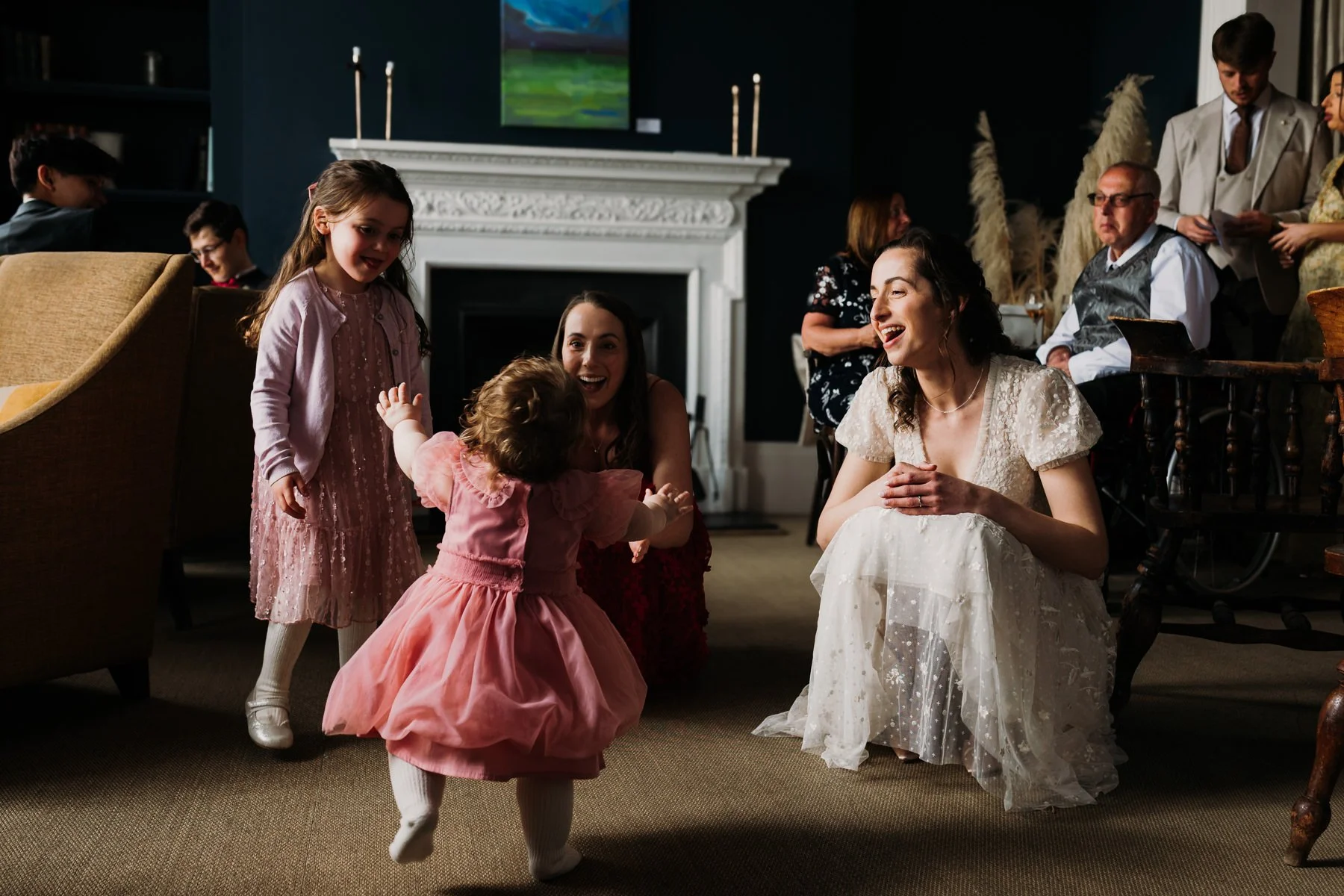 bride-and-bridesmaid-smile-at-toddler.jpg