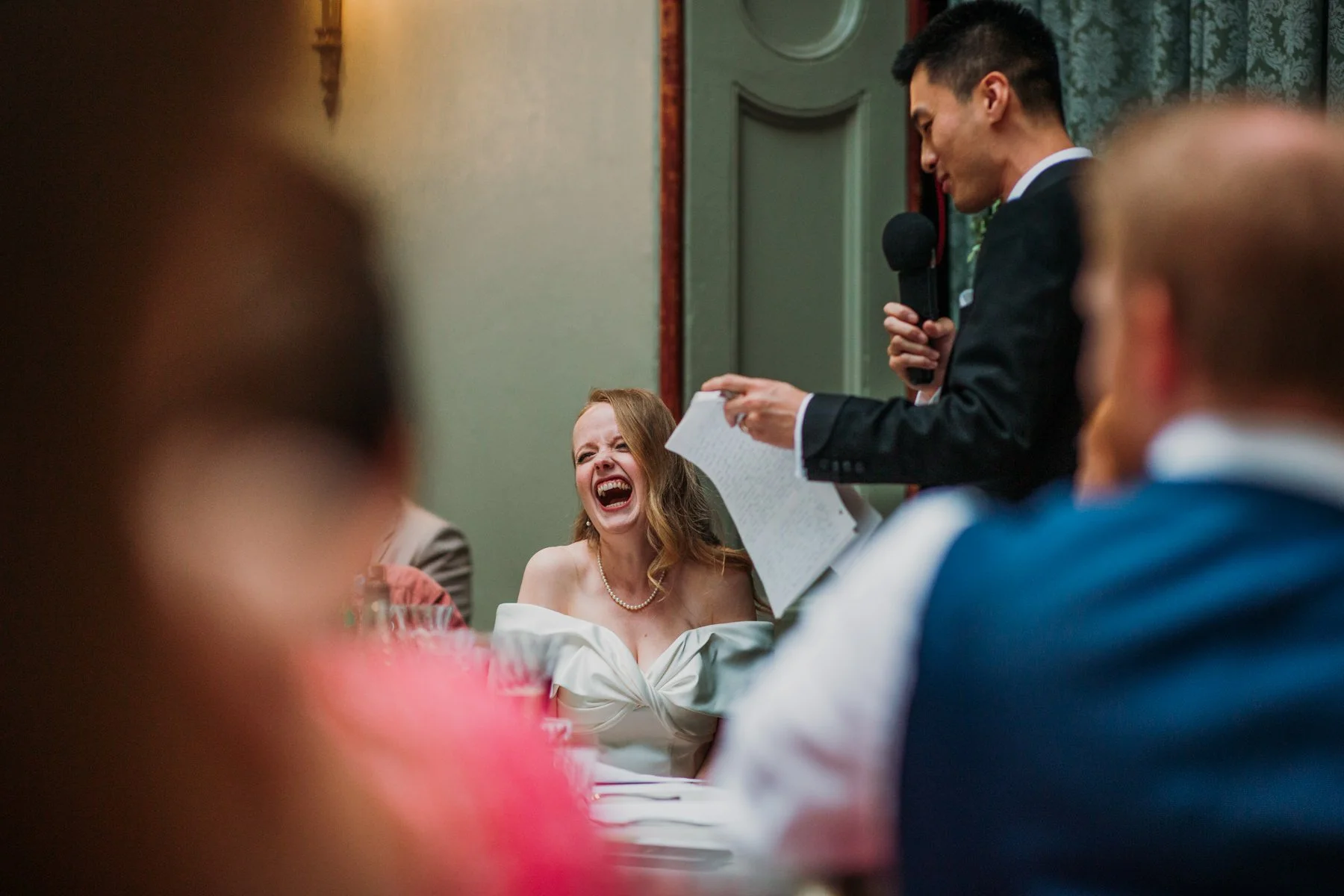 richmond-bride-laughing-at-groom-speech.jpg